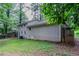 Side exterior and backyard view featuring the home's siding, windows, and wooden fence at 1539 Pine Glen Cir, Decatur, GA 30035