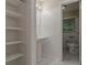 This bathroom has a sink and toilet with a set of shelves for linen storage at 1539 Pine Glen Cir, Decatur, GA 30035