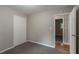 This carpeted bedroom includes a closet and a doorway to another room at 1539 Pine Glen Cir, Decatur, GA 30035