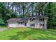 Charming split-level home with a well-maintained lawn and an attached garage at 1539 Pine Glen Cir, Decatur, GA 30035