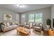 Cozy living room with neutral decor, soft lighting, and large window at 1539 Pine Glen Cir, Decatur, GA 30035