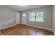 Living room with hardwood floors, fresh paint, and abundant natural light at 1539 Pine Glen Cir, Decatur, GA 30035
