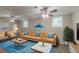 This staged living room includes two ceiling fans and two large windows at 1539 Pine Glen Cir, Decatur, GA 30035