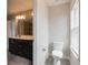 Bathroom with a double vanity, toilet, and shower, plus a window for natural light at 1949 Townsend Ne Ct # 22, Atlanta, GA 30329