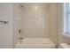 Bathroom featuring an alcove tub with shower, and a window at 1949 Townsend Ne Ct # 22, Atlanta, GA 30329