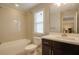 Bathroom featuring a shower/tub combo, toilet, and dark vanity at 1949 Townsend Ne Ct # 22, Atlanta, GA 30329
