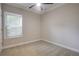 A naturally lit bedroom with carpet, ceiling fan, and neutral paint at 1949 Townsend Ne Ct # 22, Atlanta, GA 30329
