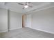 Bedroom featuring carpeted floors, a ceiling fan, and access to closet and ensuite bathroom at 1949 Townsend Ne Ct # 22, Atlanta, GA 30329