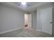 Neutral bedroom featuring gray carpet, a ceiling fan, and white doors at 1949 Townsend Ne Ct # 22, Atlanta, GA 30329