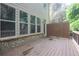 Wooden deck featuring brick facade and lush green foliage, for outdoor enjoyment at 1949 Townsend Ne Ct # 22, Atlanta, GA 30329