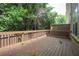 Spacious wooden deck surrounded by lush greenery, perfect for outdoor relaxation at 1949 Townsend Ne Ct # 22, Atlanta, GA 30329