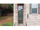 Inviting entryway with stone accents, a well-maintained lawn, and manicured landscaping at 1949 Townsend Ne Ct # 22, Atlanta, GA 30329