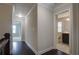 Hallway featuring dark wood floors leading to the bathroom and other rooms at 1949 Townsend Ne Ct # 22, Atlanta, GA 30329