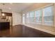 Bright living room with dark hardwood floors and large windows bringing in ample natural light at 1949 Townsend Ne Ct # 22, Atlanta, GA 30329
