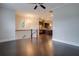 Open-concept living room with hardwood floors connecting to the modern kitchen at 1949 Townsend Ne Ct # 22, Atlanta, GA 30329
