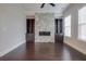 Stylish living room featuring a modern fireplace, custom built-in shelving, and rich hardwood flooring at 1949 Townsend Ne Ct # 22, Atlanta, GA 30329