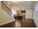 Open floor plan with a staircase, kitchen island, and stainless steel refrigerator at 1949 Townsend Ne Ct # 22, Atlanta, GA 30329