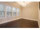 Living room with multiple windows and dark hardwood floors at 1949 Townsend Ne Ct # 22, Atlanta, GA 30329