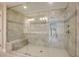 Tiled walk-in shower featuring frameless glass doors, a bench, and dual shower heads at 1949 Townsend Ne Ct # 22, Atlanta, GA 30329