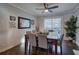A dining room featuring a table with seating for six, neutral wall color and natural light coming in from the patio door at 52 Buena Vista Se Cir, Cartersville, GA 30121