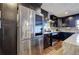 Kitchen featuring modern stainless steel appliances, dark cabinets, and stone counters at 52 Buena Vista Se Cir, Cartersville, GA 30121