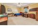 Cozy bedroom with neutral walls and carpet flooring, featuring desk and chair, and warm lighting at 11880 Wexford Club Dr, Roswell, GA 30075