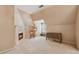 Comfortable bonus room featuring a fireplace and well-lit interior, perfect for relaxation and enjoyment at 11880 Wexford Club Dr, Roswell, GA 30075