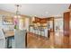 Bright kitchen with stainless steel appliances, wooden cabinetry, and a granite-topped island at 11880 Wexford Club Dr, Roswell, GA 30075