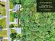 Aerial view shows property outline, neighborhood street, and surrounding greenery at 2314 Robin Dr, Loganville, GA 30052