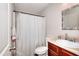Bright bathroom featuring toilet, vanity, sink and tub/shower combo with modern fixtures at 2314 Robin Dr, Loganville, GA 30052
