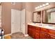 Well-lit bathroom featuring double sinks, a spacious vanity, and modern fixtures at 2314 Robin Dr, Loganville, GA 30052