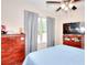 Bedroom featuring dresser, ceiling fan, natural light and calming light blue paint at 2314 Robin Dr, Loganville, GA 30052