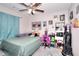 Bedroom featuring ceiling fan, carpet, unique decor and calming neutral paint at 2314 Robin Dr, Loganville, GA 30052