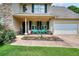 Charming front porch with colorful seating and landscaping, creating a welcoming entrance at 2314 Robin Dr, Loganville, GA 30052