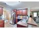 Open concept kitchen with stainless steel appliances, ample counter space, and seamless flow to living area at 2314 Robin Dr, Loganville, GA 30052