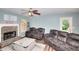 Cozy living room with stone fireplace, comfortable seating, and plenty of natural light at 2314 Robin Dr, Loganville, GA 30052