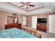Bright main bedroom offering ample space, a ceiling fan, and natural light from the windows at 2314 Robin Dr, Loganville, GA 30052