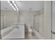 Bright bathroom with a large vanity, a well-lit mirror, and a shower-tub combo at 100 Chestnut Hill Dr, Canton, GA 30114