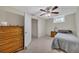 Cozy bedroom featuring neutral walls, plush carpeting, and a classic ceiling fan at 100 Chestnut Hill Dr, Canton, GA 30114