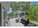 Outdoor deck with grill and pergola, perfect for entertaining in a charming backyard setting at 100 Chestnut Hill Dr, Canton, GA 30114