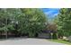 Wide paved driveway surrounded by mature trees provides ample parking space at 100 Chestnut Hill Dr, Canton, GA 30114