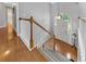 Bright foyer with hardwood floors, staircase, and view of the front door at 100 Chestnut Hill Dr, Canton, GA 30114