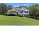 Charming two-story home with manicured lawn and traditional architectural details at 100 Chestnut Hill Dr, Canton, GA 30114