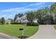 Suburban home featuring a long driveway and a neatly kept front lawn at 100 Chestnut Hill Dr, Canton, GA 30114