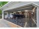 Well-organized garage with epoxy flooring houses a boat and various equipment with storage solutions at 100 Chestnut Hill Dr, Canton, GA 30114