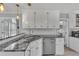 Kitchen features granite countertops, stainless appliances and sink, and white cabinets at 100 Chestnut Hill Dr, Canton, GA 30114