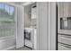 A convenient, bright laundry area is adjacent to the kitchen with storage at 100 Chestnut Hill Dr, Canton, GA 30114