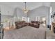 Spacious living room with vaulted ceiling and fireplace, perfect for entertaining at 100 Chestnut Hill Dr, Canton, GA 30114