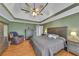 Spacious main bedroom featuring a tray ceiling, fan, and ensuite bathroom at 100 Chestnut Hill Dr, Canton, GA 30114