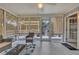 Inviting sunroom with tiled floors and natural light at 100 Chestnut Hill Dr, Canton, GA 30114